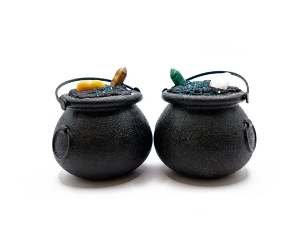 two cauldron-shaped bath bombs