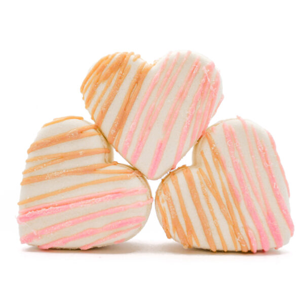 stack of heart-shaped tangerine, coconut, and magnolia-scented bath bombs